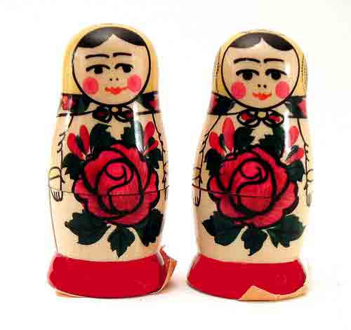 Semenov Matryoshka Salt and Pepper Set. A pair of adorable "Mashenka" Semenov maiden Salt & Pepper shakers. These were made in the 1990s in Russia and have the orange paper labels. Decorative and functional. Why buy plastic Matryoshka themes when you can have the original painted on wood? Each shaker is 2¼" tall. 1 set left.