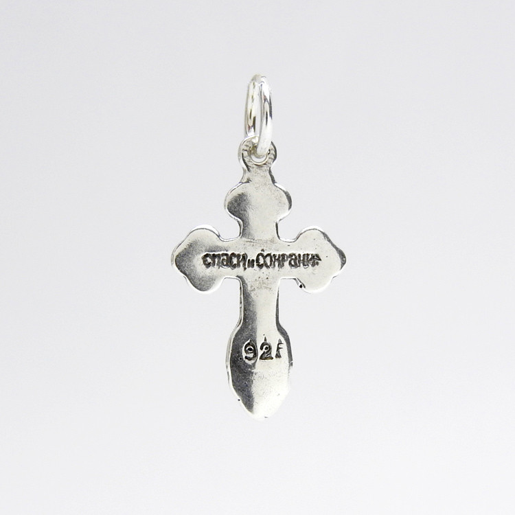 Sterling Silver Orthodox Baptism Cross. An elegant tiny silver cross is just perfect for a newborn. Elegant engraved design has the initials for Jesus Christ "ИС ХС" and a descending dove representing the Holy Spirit. A prayer in Russian on the back reads Спаси и Сохрани (Save and Protect). ½" (12mm). Sterling silver, cast by hand in small batches using the lost wax method. Elegantly gift boxed.