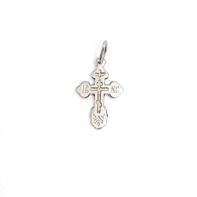 Sterling Silver Orthodox Baptism Cross. An elegant tiny silver cross is just perfect for a newborn. Elegant engraved design has the initials for Jesus Christ "ИС ХС" and a descending dove representing the Holy Spirit. A prayer in Russian on the back reads Спаси и Сохрани (Save and Protect). ½" (12mm). Sterling silver, cast by hand in small batches using the lost wax method. Elegantly gift boxed.
