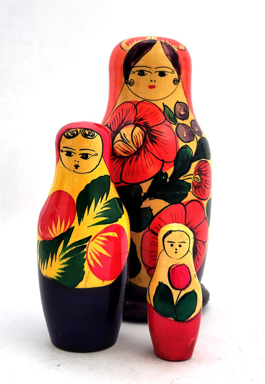 Polkhovsky-Maidan or Krutets (Полховский-Майдан или Крутец). A vintage pure folk art matryoshka with classical Polkh stylings. It's simply decorated with primary colors. Note the small eyes and the part of her hair - two curls peeking out from a long veil. Probably late 1950s-early 1960s. Uncommon. 3 nest, 6¾" in height