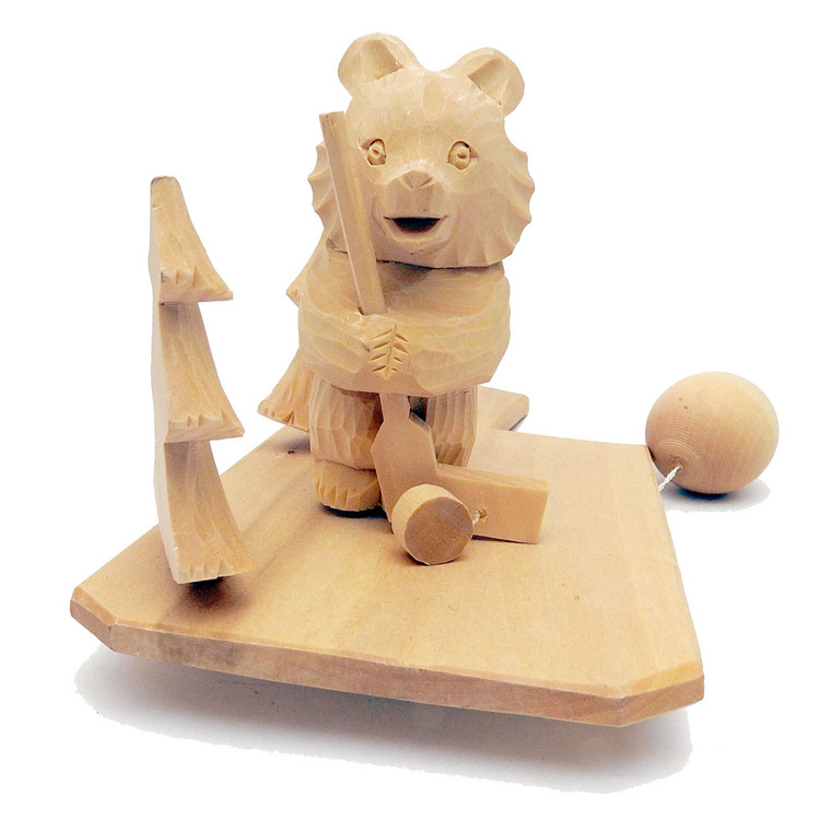 Misha Plays Ice Hockey (Миша играет в хоккей). The "all-pro" Misha the Bear finds a bit of ice between two pine trees and works on his flip shot. Ball activated toy with an ingenious mechanism. Finely carved and signed by the two artists.