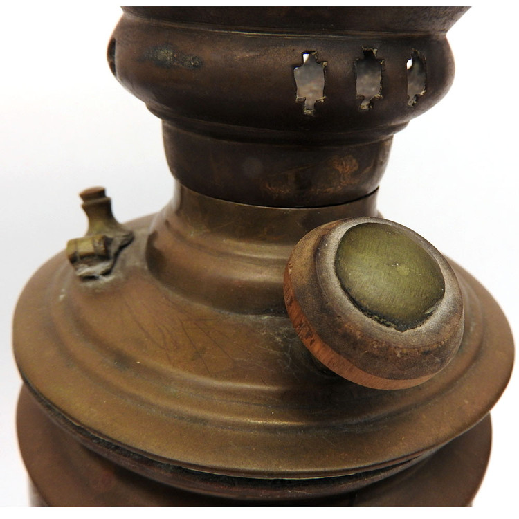 Pre-revolutionary small brass samovar. An unusual addition to a samovar collection. Hand made, probably Tula - see the array of nuts holding the knobs. In distressed, used condition. Theories abound for this one. 1) it might have been carried around for a quick boil of water to prepare one or two cups of tea, 2) it's part of a child's tea set, and 3) it was a salesman's sample.