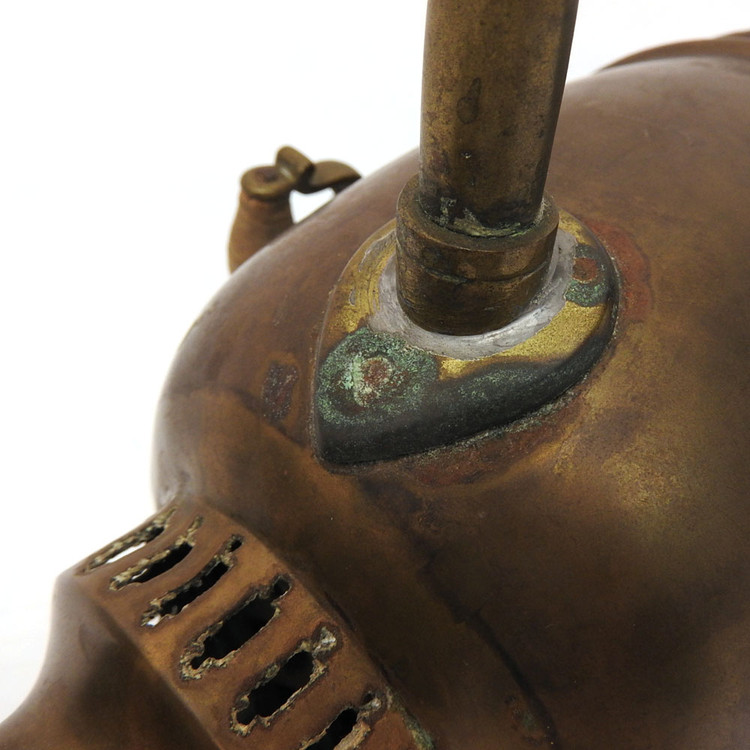 Pre-revolutionary small brass samovar. An unusual addition to a samovar collection. Hand made, probably Tula - see the array of nuts holding the knobs. In distressed, used condition. Theories abound for this one. 1) it might have been carried around for a quick boil of water to prepare one or two cups of tea, 2) it's part of a child's tea set, and 3) it was a salesman's sample.