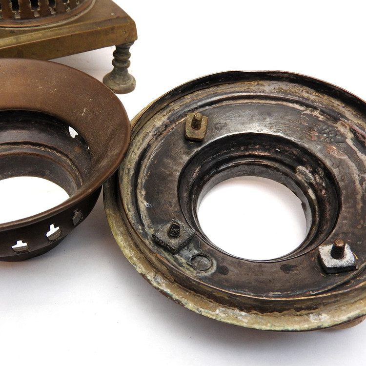 Pre-revolutionary small brass samovar. An unusual addition to a samovar collection. Hand made, probably Tula - see the array of nuts holding the knobs. In distressed, used condition. Theories abound for this one. 1) it might have been carried around for a quick boil of water to prepare one or two cups of tea, 2) it's part of a child's tea set, and 3) it was a salesman's sample.