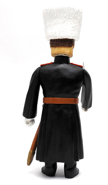 Beautifully detailed and painted carved figure dressed in the characteristic black uniform (cherkesska) of the Kuban Cossacks, made in Russia