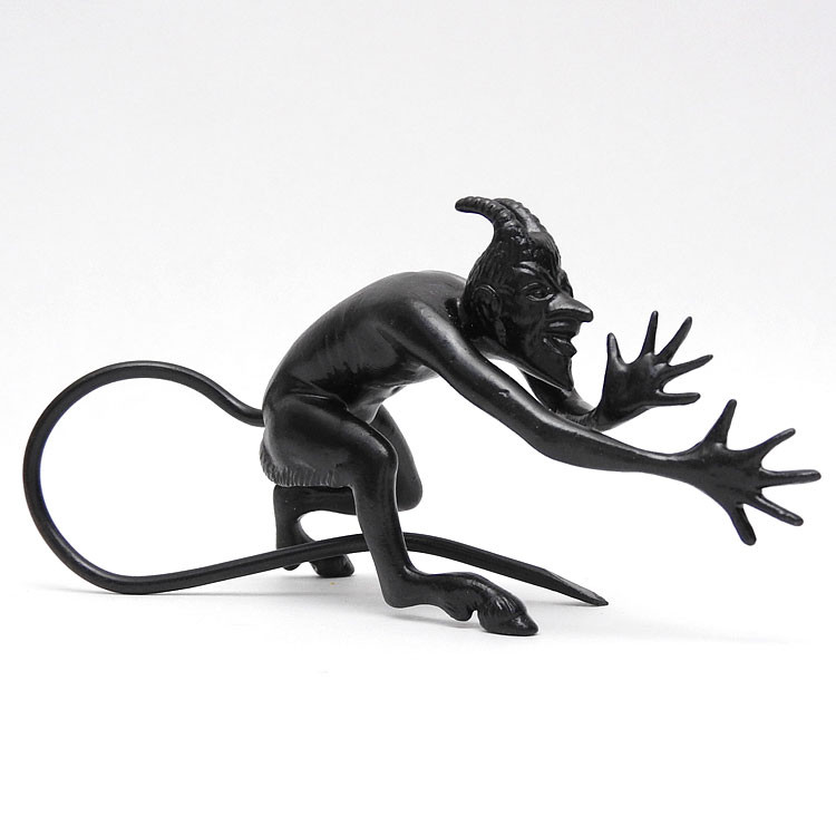 Chyort (Devil). Double-handed mocking "thumbing nose" pose. Cast iron (Dutch soot). Shiny black finish. Made in Kasli circa 1970-1980.