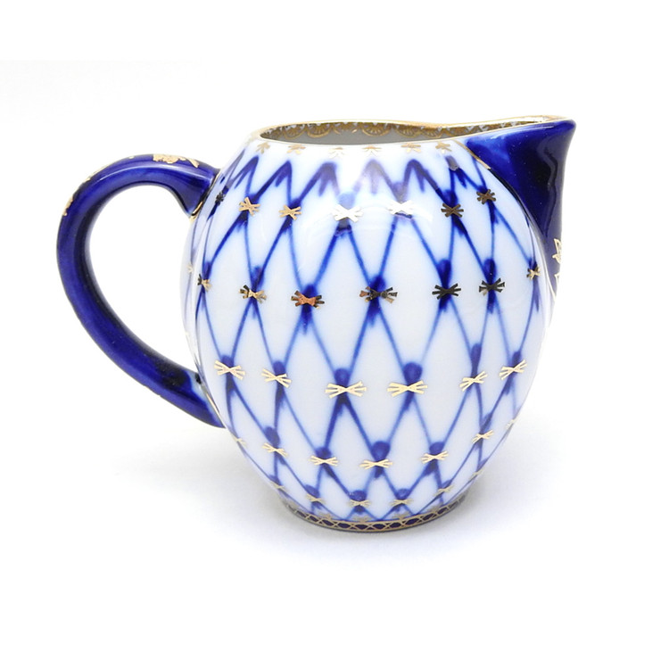 Cobalt Net Small Milk or Cream Pitcher. Elegant small pitcher from the Lomonosov Porcelain Factory in St. Petersburg, Russia. Makes a terrific gift! Fully hand painted and decorated. Not a Chinese knock-off!  Mineral cobalt, 22Kt gold. 3" height, 3¾" width, 6oz. capacity.