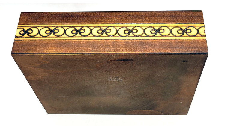 Set of 5 nested wooden Polish boxes. Crafted in Zakopane (Podhale region), a town which lies at the foothills of the Tatra Mountains. Each box is identically carved and stained with decorations incised using the techniques of the craft of traditional pyrography (woodburning). Boxes are lined with bright red felt (a nice touch), and nest perfectly within one another. The center of each box is a spiral flower with red and green enhancements and the surrounding wood is intricately textured. Three largest boxes have elaborate edge borders. An unusual set in brand new condition.