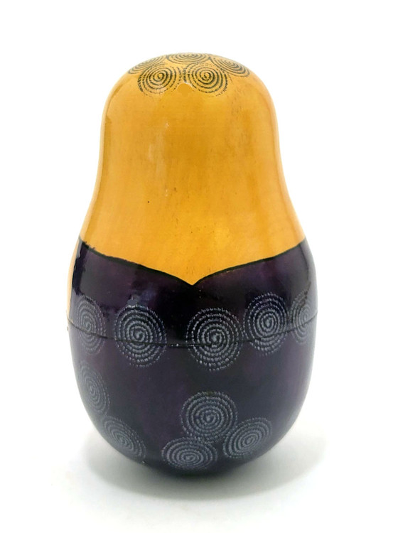 Viatka Maiden Roly Poly Chime Doll. Early 1980s Viatka (aka Kirov) chime doll painted in traditional colors. These were uncommon in the day, and now we rarely see them. The Russian traditional roly poly toy has many different names, including "nevalyashka"(неваляшка), "vanka-vstanka" (ванька-встанька) and roly-poly chime doll. Due to the weight in the bottom half, the doll will sway and return upright, as well as give a pleasant bell sound.