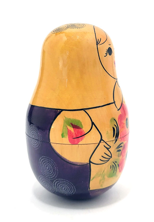 Viatka Maiden Roly Poly Chime Doll. Early 1980s Viatka (aka Kirov) chime doll painted in traditional colors. These were uncommon in the day, and now we rarely see them. The Russian traditional roly poly toy has many different names, including "nevalyashka"(неваляшка), "vanka-vstanka" (ванька-встанька) and roly-poly chime doll. Due to the weight in the bottom half, the doll will sway and return upright, as well as give a pleasant bell sound.