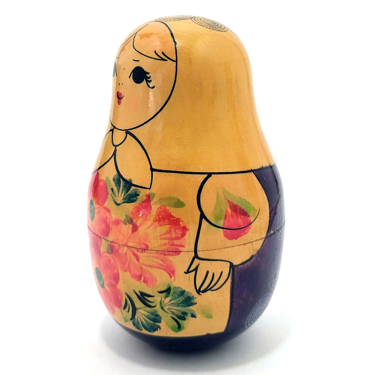 Viatka Maiden Roly Poly Chime Doll. Early 1980s Viatka (aka Kirov) chime doll painted in traditional colors. These were uncommon in the day, and now we rarely see them. The Russian traditional roly poly toy has many different names, including "nevalyashka"(неваляшка), "vanka-vstanka" (ванька-встанька) and roly-poly chime doll. Due to the weight in the bottom half, the doll will sway and return upright, as well as give a pleasant bell sound.