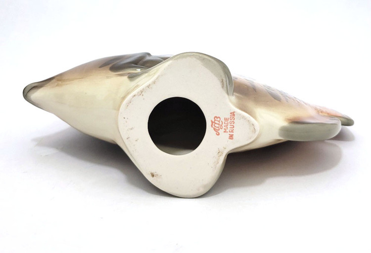 The lovely, striped discus, aka pompadour, fish as created in the Lomonosov Porcelain Factory in St. Petersburg. 8½" x 3" x 7¼". Hand painted, Lomonosov backstamp. The symphysodon is a genus of cichlids native to the Amazon river basin in Brazil. Due to their distinctive shape, calm behavior, and dedicated parenting techniques, discus are popular as freshwater aquarium fish. It has attracted a large hobbyist following and has created a multimillion dollar international industry complete with shows, competitions, and reputable online breeders. The lovely, striped discus, aka pompadour, fish as created in the Lomonosov Porcelain Factory in St. Petersburg. 8½" x 3" x 7¼". Hand painted, Lomonosov backstamp. The symphysodon is a genus of cichlids native to the Amazon river basin in Brazil. Due to their distinctive shape, calm behavior, and dedicated parenting techniques, discus are popular as freshwater aquarium fish. It has attracted a large hobbyist following and has created a multimillion dollar international industry complete with shows, competitions, and reputable online breeders.