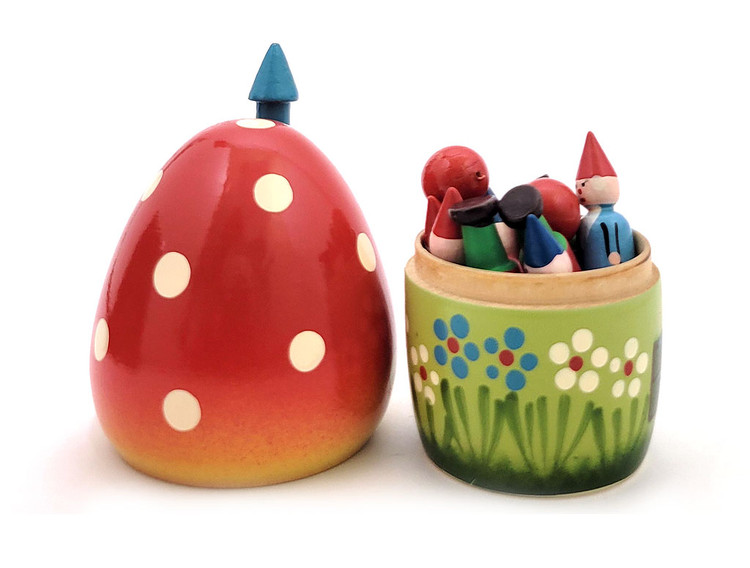 Mushroom House and Ten Gnomes Bowling Toy Set. Vintage Polish nesting toy from the 1980s. Ten colorful wood gnomes and two red wooden balls are housed in a mushroom house. All wood, hand painted. A few decades ago, Polish artisans produced nesting dolls that were exported to the US, as well as elsewhere.  In near fine, virtually unplayed with, complete condition. House is about 5" with chimney stack and gnomes are about 2" in height.
