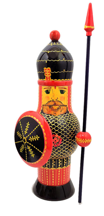 The Legendary Bogatyr (Легендарный Богатырь). The bogatyr is an ancient hero or warrior somewhat like a Western European knight errant. Most of stories about bogatyrs revolve around the court of Vladimir I of Kiev (958–1015). The most prominent bogatyrs were the trio of Alyosha Popovich, Dobrynya Nikitich and Ilya Muromets, each distinguished by a character trait: Alyosha Popovich for his wits, Dobrynya Nikitich for his courage, and Ilya Muromets for his physical and spiritual power and integrity, and for his dedication to the protection of his homeland and people.

This extraordinary sculptured figure stands over 16" tall! Each bogatyr is completely hand made. To simulate chainmail, hundreds of tiny pieces of straw were painstakingly inlaid. The straw is a special variety of rye harvested with a scythe, then boiled in a potassium solution to achieve the color of gold. The cut-into-shape straw is then fastened and covered with an oil lacquer. A marvel of Russian folk art! Made in the late 1980s.