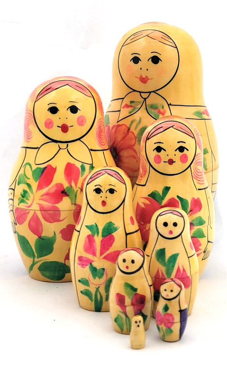 Kirov Purple Matryoshka, 8nest [1979]. Scarce color arrangement of an 8pc Kirov doll, circa 1977. This matryoshka set was made nearly 50 years ago, some 20 years after the formation of the production center itself. Any nesting dolls from the last quarter of the 20th century are somewhat scarce in about fine, unplayed with condition. Of note here is the continuation of the color purple dresses of the first three pieces, and one more near the end. The lines are sharp, as are the features, on the first four pieces, and the expressions are somber. The flowers, dots and swirls are numerous. The pieces all fit well. There is some age-related wear at the opening, but this can be color touched, if desired (we haven't). This is a highly collectible, 49 year-old set in about fine condition. 5⅝" down to tiny. The label reads (in part): Производственное объединение "Вятка" по выпуску игрушек г. Киров (Production association "Vyatka" for the production of toys, city of Kirov), plus a state mandated price, an article number and the export date (Oct 1983).  It's not easy to find information on how the Russian toy, specifically the Matryoshka doll, came to be the number one tourist and export item of the USSR era. The Russian, aka Soviet, toy production began courting the tourist trade in earnest sometime in the 1960s, when it encouraged small collectives and factories to produce souvenirs to be sold to non-Russians. It started slowly, but eventually built up speed as the Moscow 1980s Olympics was slated to welcome foreign, specifically from Europe and the West (aka USA), tourists. Interest in Russian handicrafts was also stoked by importers of said goods in the US and elsewhere.
