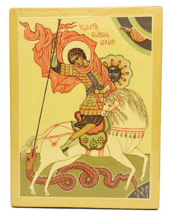St. George Slaying the Dragon. The title reads Чудо Георгия о змие (in Old Slavonic, of course) and literally means The Miracle of St. George and the Dragon. Here he rides a white horse (the horse first appeared at the first millennium), as the hand of Christ emerges from a semi-circle and blesses him. It is the most well-known icon of him, which appeared in Novgorod in the 15th century. St. George is a symbol of the earthly manifestation of Archangel Michael, and is patron saint of Moscow, England, farmers, soldiers, prisoners and the poor, and scouting