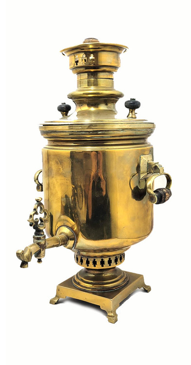 Large and heavy pre-revolutionary brass samovar.  1890-1910. Tula, Russia. In about fine condition, no major dents or missing parts. The golden brass is warm quality and has been cleaned often by the former owner. About 19¾" in height and weighs slightly over 13½ lbs. The inside chamber has calcium and mineral deposits indicative of prior use. The burn chamber plate, essentially a grill, is intact and clips on.  All parts, including key, grips, cap, etc., appear to be original.e factory award medals and identification has been polished nearly out of existence, but a closer look reveals the word "Ivan" and "Batashev". The era is 1890-1910. Ivan Grigoryevich Batashev is one of the most famous and well-known samovar makers in Tula