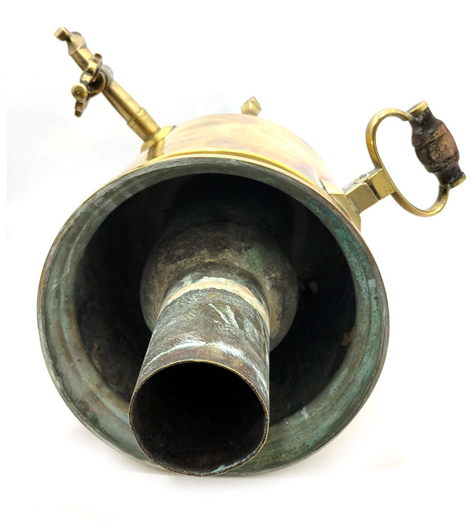 Large and heavy pre-revolutionary brass samovar.  1890-1910. Tula, Russia. In about fine condition, no major dents or missing parts. The golden brass is warm quality and has been cleaned often by the former owner. About 19¾" in height and weighs slightly over 13½ lbs. The inside chamber has calcium and mineral deposits indicative of prior use. The burn chamber plate, essentially a grill, is intact and clips on.  All parts, including key, grips, cap, etc., appear to be original.e factory award medals and identification has been polished nearly out of existence, but a closer look reveals the word "Ivan" and "Batashev". The era is 1890-1910. Ivan Grigoryevich Batashev is one of the most famous and well-known samovar makers in Tula