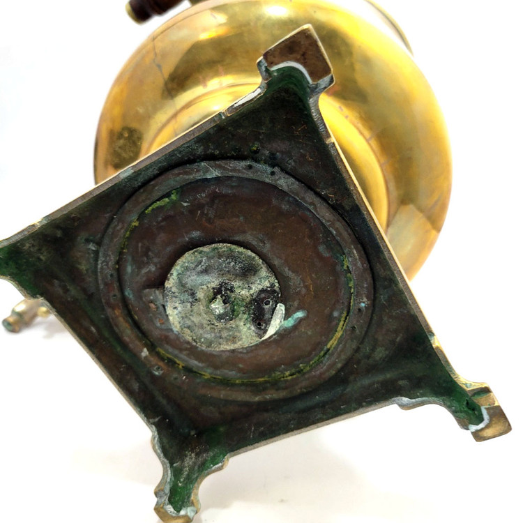 Large and heavy pre-revolutionary brass samovar.  1890-1910. Tula, Russia. In about fine condition, no major dents or missing parts. The golden brass is warm quality and has been cleaned often by the former owner. About 19¾" in height and weighs slightly over 13½ lbs. The inside chamber has calcium and mineral deposits indicative of prior use. The burn chamber plate, essentially a grill, is intact and clips on.  All parts, including key, grips, cap, etc., appear to be original.e factory award medals and identification has been polished nearly out of existence, but a closer look reveals the word "Ivan" and "Batashev". The era is 1890-1910. Ivan Grigoryevich Batashev is one of the most famous and well-known samovar makers in Tula