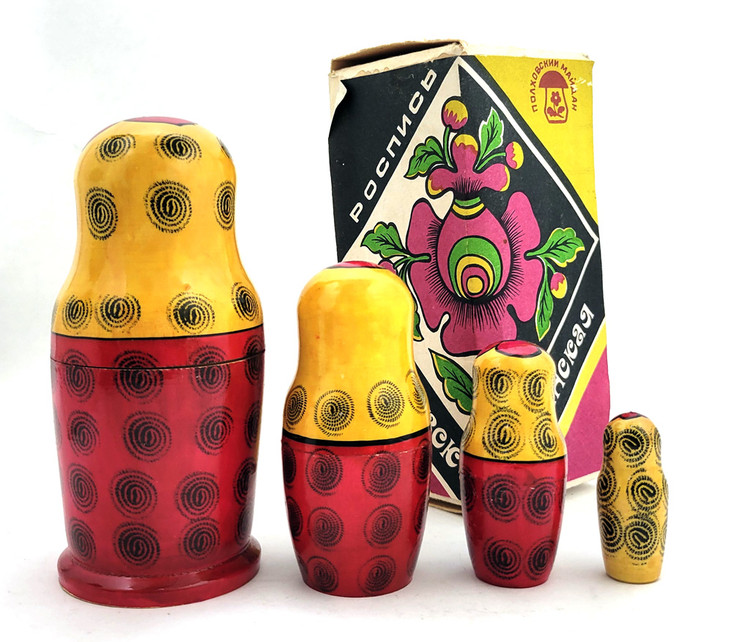 Classic Polkhovsky-Maidan matryoshkas are decorated with India ink and aniline dyes. This nesting doll, with its appealing faces, was made at the production association "Polkhovsky-Maidan painting", which brought together the artists of Krutets, Polkhovsky-Maidan and Voznesensk. A paper label in Russian gives the date of manufacture (1988), ID number (НХП-ГО-2279а) and price (6.00) in rubles.