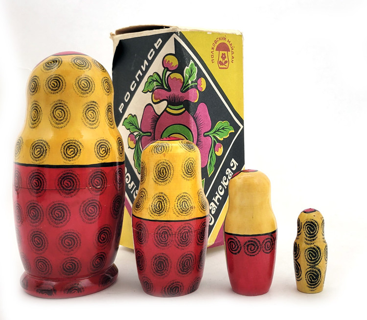 Polkhovsky-Maidan 4 nest. In the original factory packaging. Voznesensky region ("Вознесенское объединение "П-Майданская роспись"). Classic Polkhovsky-Maidan matryoshkas are decorated with India ink and aniline dyes. This nesting doll, with its appealing faces, was made at the production association "Polkhovsky-Maidan painting", which brought together the artists of Krutets, Polkhovsky-Maidan and Voznesenk. A paper label in Russian gives the date of manufacture (1988), ID number (НХП-ГО-2279а) and price (6.00) in rubles. Approx. 6" to 2¼".