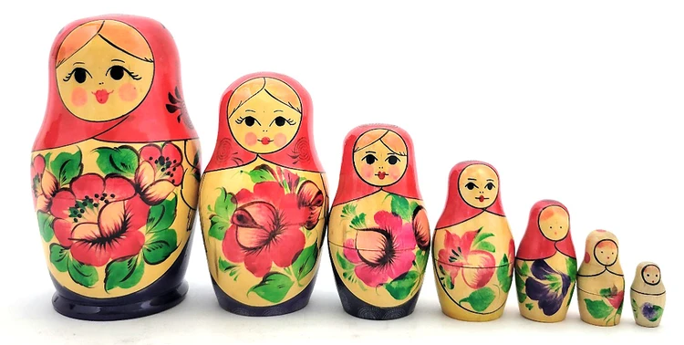 Viatka "Purple" 7-nest (Vintage). Of the over 800 hundred 7-nested USSR sets that passed through our shop, this set is the only one that has three purple dresses on the first three pieces. In about fine condition, no cracks or major signs of wear. 5" down to 1". USSR purple stamp on the bottom. 1 only.