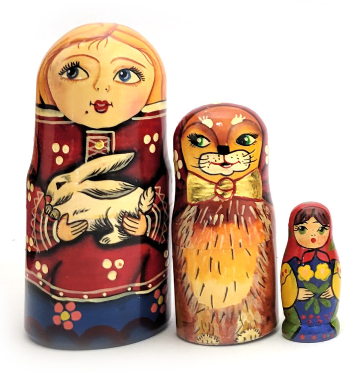 Russian Farmhouse (Русская ферма). A stylish and detailed Russian family outfitted with all the trappings of farm life, including barnyard fowl, a traditional hospitality greeting consisting of bread and salt, a krolik (bunny), the proud cat with a bowtie, and the small child at the end. Beautifully painted and lacquered in 1990s by an anonymous artist identified only by their initials and from a St. Petersburg workshop identified as "Матрена". Also, a mysterious number "1" in red is on the bottom of the first doll. Cylindrical shapes.  6 nest, 9¼" down to 2". Note: the final doll seems to have been fitted into the end of this matryoshka at the time of production, due to the difficulties of procuring materials common at the time. The artist probably had access to a 5-nest blank and needed a 6th piece, hence the girl at the end with a base.