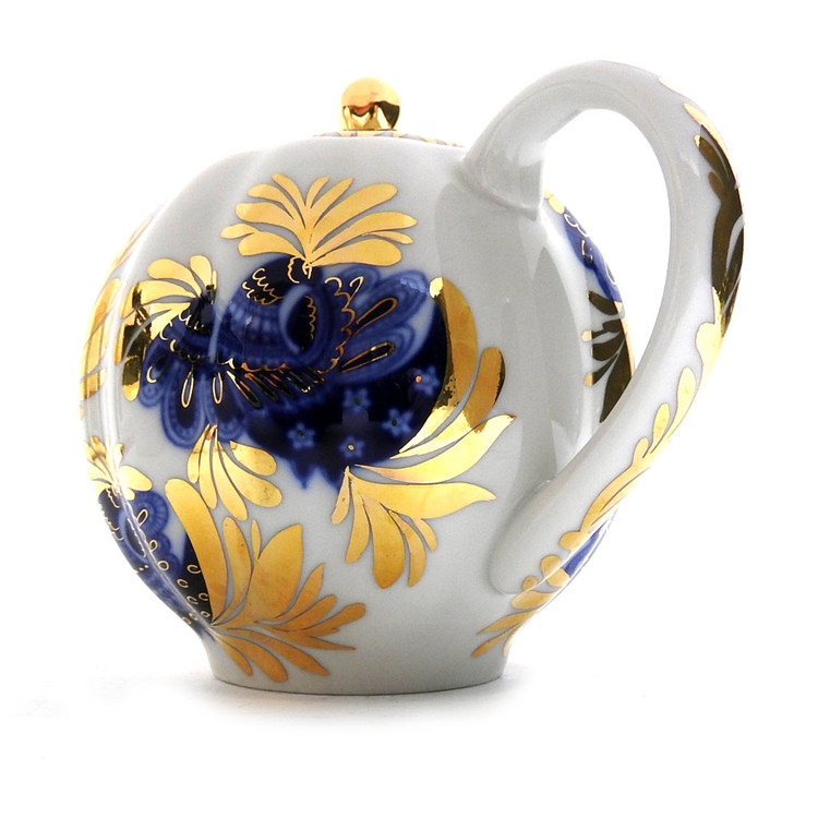 Golden Garden (Золотой сад) Teapot. A lovely montage of blue and gold on a creamy white background. Golden illuminated feathers play off of the deep cobalt blue bird. Hand decorated with a flourish! Even the lid, spout and handle have been touched by gold! 5" tall, approximately 3½ cups.  Red ЛВЗ (LFZ) backstamp and "Made in Russia" in English.