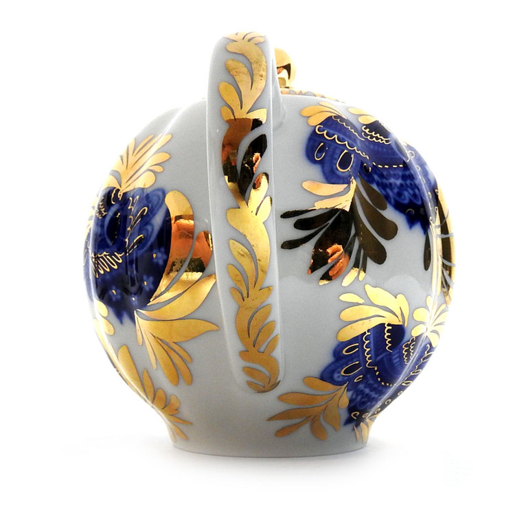 Golden Garden (Золотой сад) Teapot. A lovely montage of blue and gold on a creamy white background. Golden illuminated feathers play off of the deep cobalt blue bird. Hand decorated with a flourish! Even the lid, spout and handle have been touched by gold! 5" tall, approximately 3½ cups.  Red ЛВЗ (LFZ) backstamp and "Made in Russia" in English.