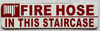 FIRE HOSE IN THIS STAIR CASE Signage