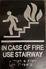 In  case of fire use Stairway sign with braille and raised letter size 6x9 inch -The sensation line ( Black/silver )