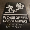 In  case of fire use Stairway sign with braille and raised letter size 6x9 inch -The sensation line ( Black/silver )