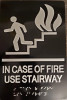 In  case of fire use Stairway sign with braille and raised letter size 6x9 inch -The sensation line ( Black/silver )