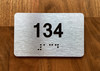 Apartment number 134 Ada Sign