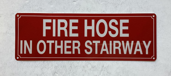 Fire hose in other stairway sign