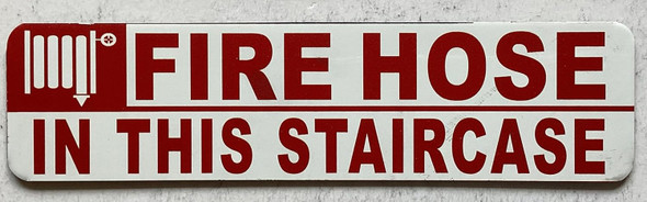 FIRE HOSE IN THIS STAIR CASE sign