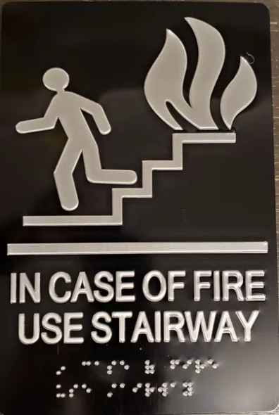In  case of fire use Stairway sign with braille and raised letter size 6x9 inch -The sensation line ( Black/silver )
