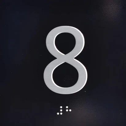 Elevator floor 8 black jamb plate 8 black sign