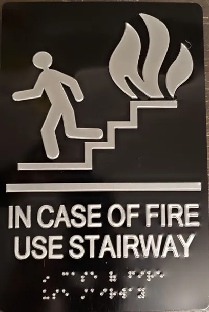 In  case of fire use Stairway sign with braille and raised letter size 6x9 inch -The sensation line ( Black/silver )