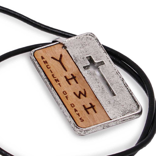 Close-up of the front engraving showing the Ancient of Days text and the vertical YHWH in English letters.