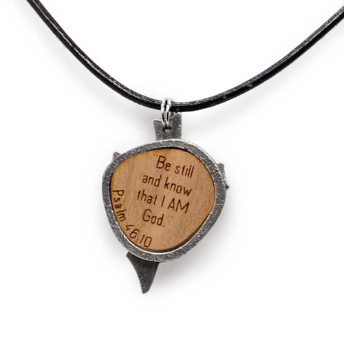 Backside view of antiqued women's cross pendant necklace with Psalm 46:10.