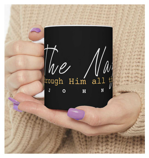 Woman holding 10oz Christian coffee mug. Woman holding 10oz Christian coffee mug.