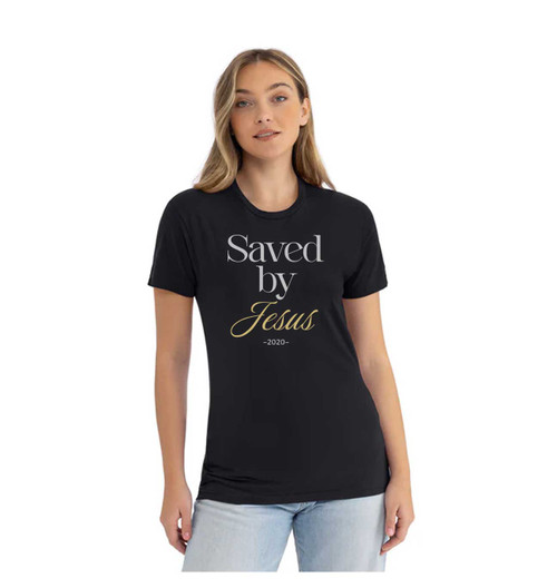 Female model wearing a black colored 'Saved by Jesus' t-shirt that displays the date she gave her life to Christ.