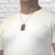 Man wearing walnut wood Dog Tag necklace.