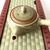 Teapot on tatami background