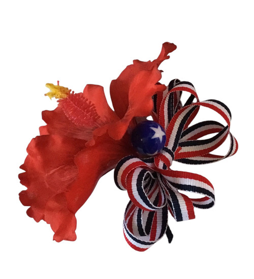 Patriotic hair clip accessory featuring a red hibiscus flower
