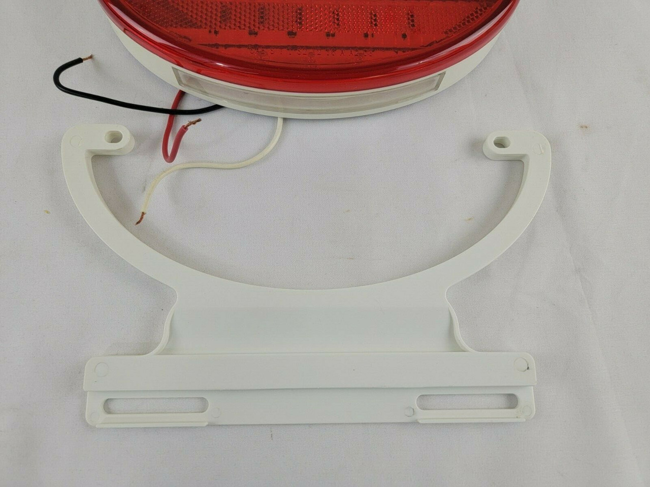 Diamond Group Kaper II 8" Oval LED Stop Turn Tail Light w/ License Plate Bracket