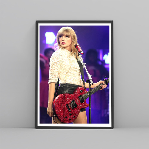 Taylor Swift With The Red Guitar Posters