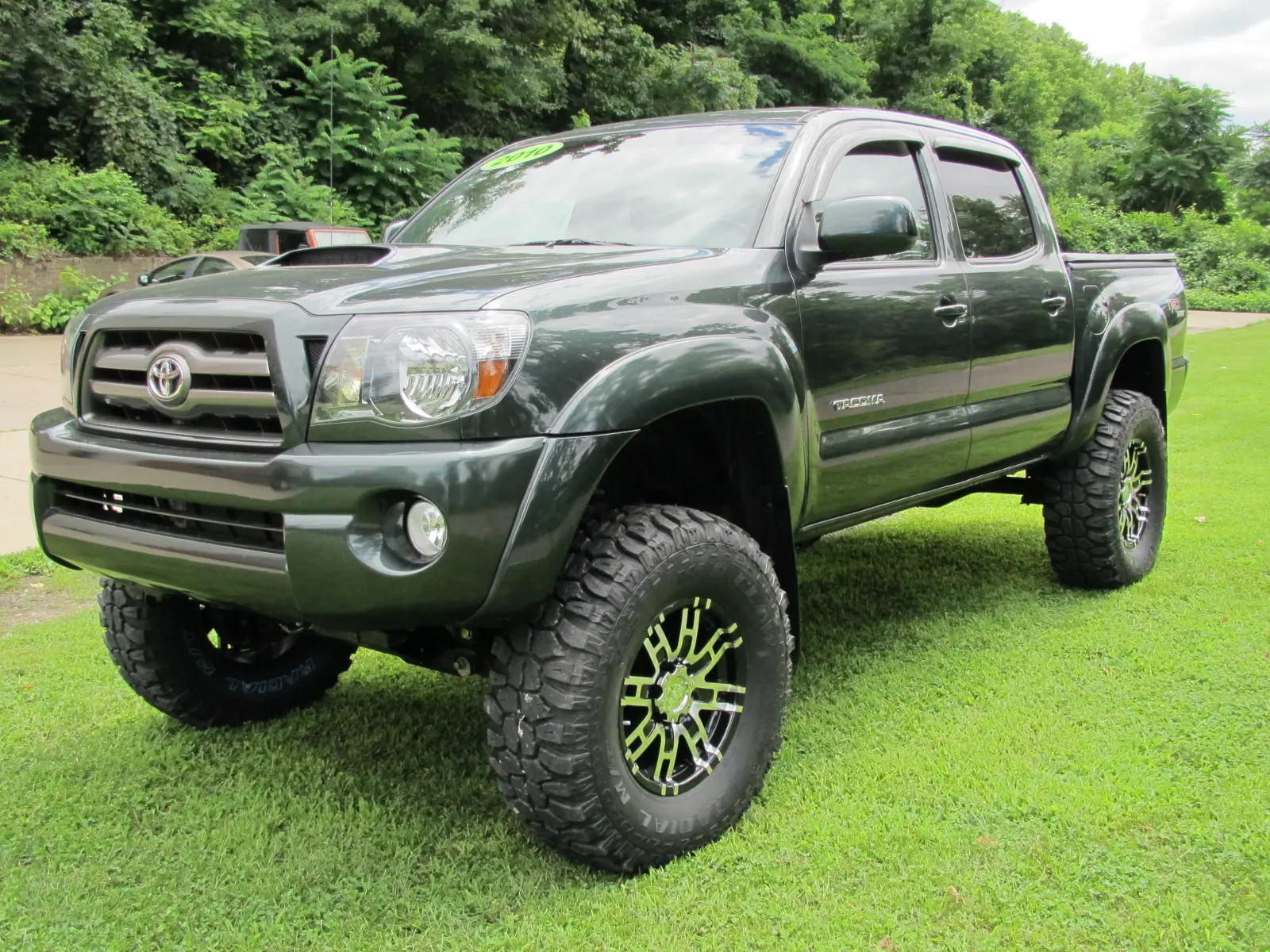 Real Tacoma build: 2010 Toyota Tacoma on a 6 inch Rough Country lift with 35x12.50R17 Mud Claw tires and 17x8 Helo 835 wheels