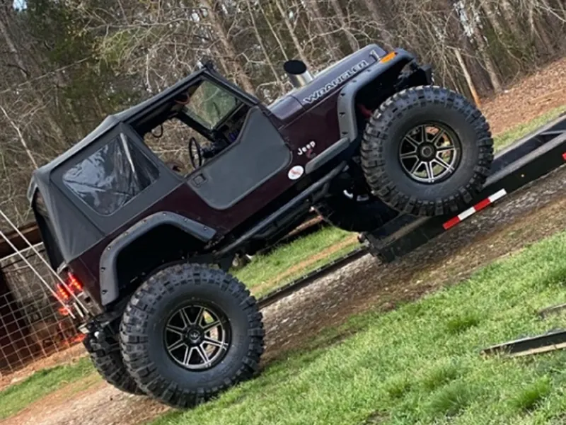 92 Jeep Wrangler with 14 inches of lift and a 12 valve Cummins